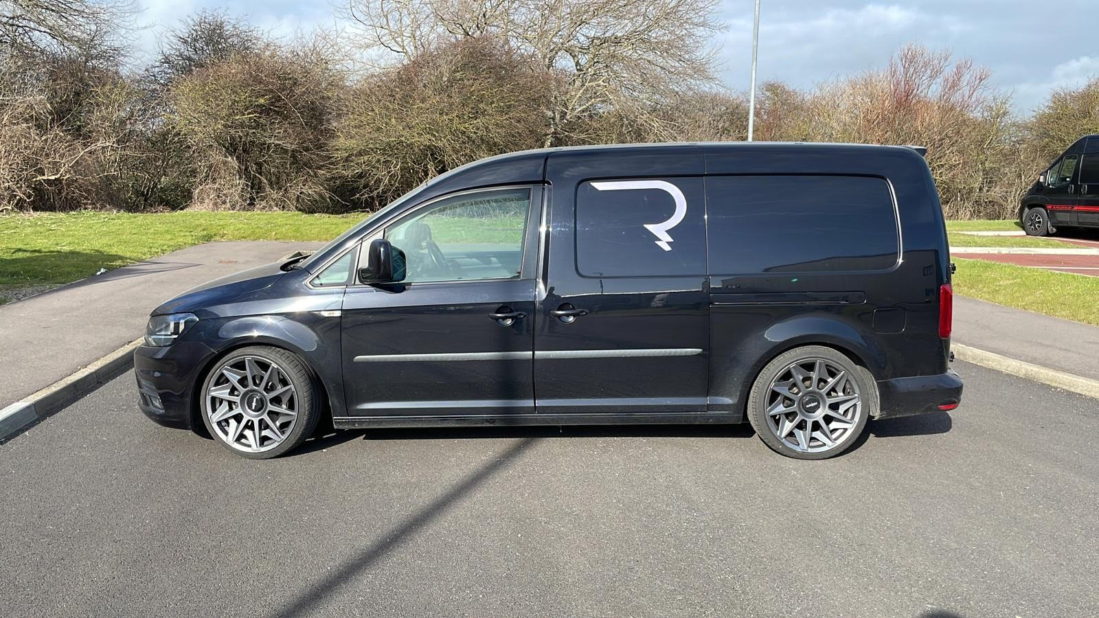 https://www.lovecampers.co.uk/wp-content/uploads/2022/02/BLACK-LOWERED-VW-CADDY-FOR-SALE.jpg